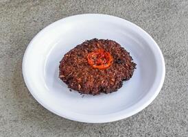 beef chappal kabab served in plate isolated on grey background top view of pakistani and indian spices food photo