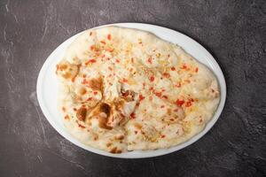 Special tandoori kashmiri Nan, naan, bread, roti and nun served in dish isolated on background top view of bangladesh food photo