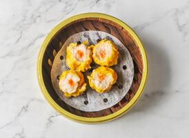 minced pork and shrimp dumpling served dish isolated on background top view of chinese and thai food photo