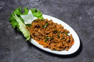 Schezwan Beef ginger served in dish isolated on grey background top view of indian and bangladesh food photo