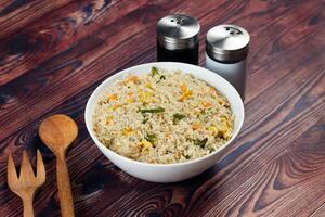 Egg Fried Rice served in a dish isolated on background side view of chinese food photo