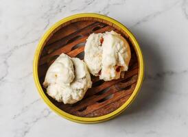 Steamed bbq pork bun served dish isolated on background top view of chinese and thai food photo