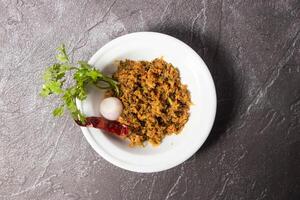 Ilish Bhorta hilsa served in dish isolated on background top view of bangladesh food photo