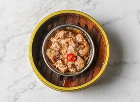 steamed pork ribs with chilli served dish isolated on background top view of chinese and thai food photo