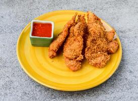 crispy chicken fry with chilli sauce served in dish isolated on background top view of asian food photo