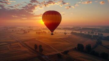 AI generated Hot air ballooning floats over patchwork fields at sunrise, offering a breathtaking view photo