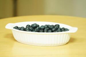 closeup view of Blueberries in a plate on the table photo