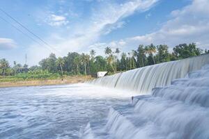 A beautiful view of a waterfall from a check dam In Kerala, India. photo