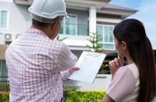 Senior home inspector explains Inspection results with homeowner, handyman holding clipboard and after checking details before renovations home, house improvement interior, Interior design Real estate photo
