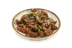 AI generated Bulgogi served on a plate isolated on white background photo