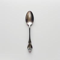 AI generated minimalistic style silver spoon on white background top view photo