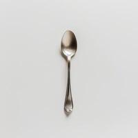 AI generated minimalistic style silver spoon on white background top view photo