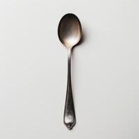 AI generated minimalistic style silver spoon on white background top view photo