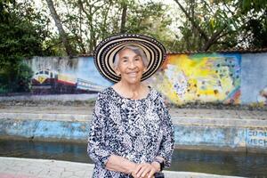 Senior woman tourist at the Macondo Linear Park in Aracataca the birthplace of the Colombian Literature Nobel Prize Gabriel Garcia Marquez photo