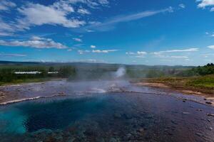 Iceland travel seeing landscape both natural and in the city environment - golden circle tourism in Iceland - traveling in northern world between europe and america photo