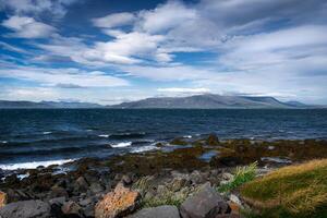 Iceland travel seeing landscape both natural and in the city environment - golden circle tourism in Iceland - traveling in northern world between europe and america photo