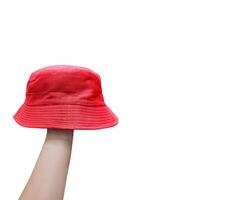 red bucket hat on man's hand photo