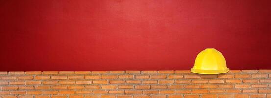 Helmet on red brick wall  red cement floor photo