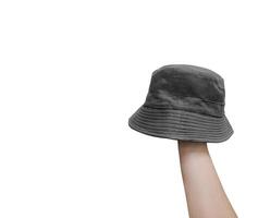 Black bucket hat on hand Isolated on a white background photo