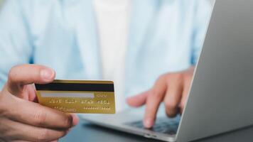 Online payment, Man using computer and credit card for online shopping, Digital online payment concept, Technology online banking applications via internet network, financial transaction. photo