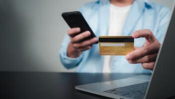 Online payment, Man using computer and credit card for online shopping, Digital online payment concept, Technology online banking applications via internet network, financial transaction. photo