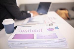 The pile of documents on the secretary's desk was prepared for the executives who would be attending the meeting. Several documents were stacked on the secretary's desk ready for the attendees. photo