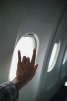 young man raises his hand and makes sign language symbol of I love you show love and friendship for each other. Sign language is also universal language that can be easily understood as saying love. photo