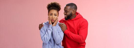 Boyfriend comforting worried nervous girlfriend attend dentist frowning touching face anxiously panicking man hugging girl touch shoulders smiling encourage, look supportive assuring all okay photo