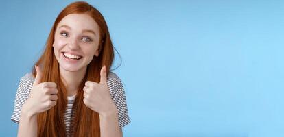 Nice idea keep up. Supportive tender cute european ginger girl blue eyes cheering friend boost mood show thumbs up smiling approval like good choice, agree interesting suggestion, satisfied photo