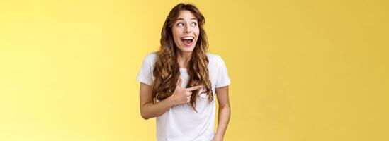 Funny amused cute girlfriend enjoy awesome party having wonderful time spend amazing day city fair open mouth surprised fascinated observe admiration lgbtq pride parade happy yellow background photo