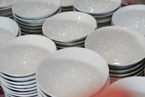 Ceramic tableware in a store, closeup of photo