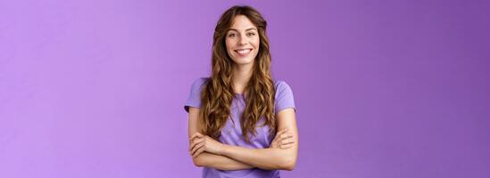 Confident professional skillful female photographer freelancer ready photo competition cross hands chest motivated assertive pose smiling broadly confident own abilities stand purple background