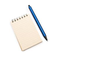 Spiral notepad and pencil isolated on white background. Blank one face brown paper note. empty sheet of brown lined papers. photo