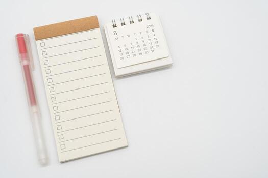 Blank Check list or Empty small notepad with checkbox and Simple desk calendar for AUGUST 2024. Blank checklist for text. Copy Space. photo