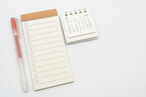 Blank Check list or Empty small notepad with checkbox and Simple desk calendar for MAY 2024. Blank checklist for text. Copy Space. photo