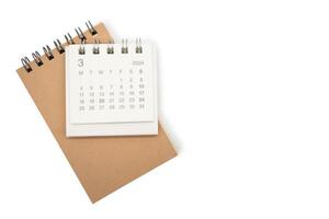 Simple desk calendar for MARCH 2024 and blank memo isolated on white background. Calendar concept with copy space. photo