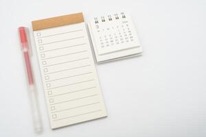 Blank Check list or Empty small notepad with checkbox and Simple desk calendar for MARCH 2024. Blank checklist for text. Copy Space. photo