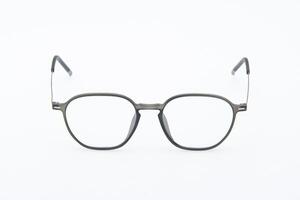 Retro glasses style. Fashion sunglasses grey frames on white background. photo