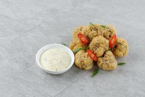 mushrooms in batter on a stone background studio food photo 4