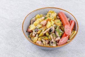 fried potatoes with mushrooms and sausages on a stone background studio food photo 1