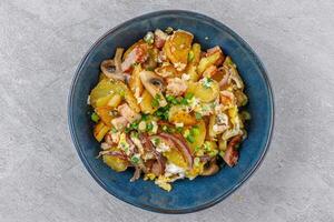 fried potatoes with mushrooms and ham on a stone background studio food photo 4