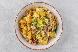 fried potatoes with mushrooms and ham on a stone background studio food photo 5