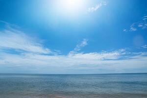 the beach with blue sky and clouds photo