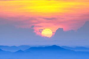 Sunrise with the fog is spreading to the horizon. photo