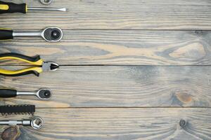 Different tools on a wooden background. photo