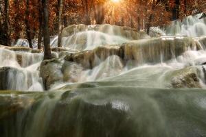 Limestone waterfall in the autumn photo