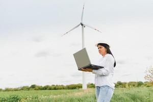 Engineer working at wind turbines photo