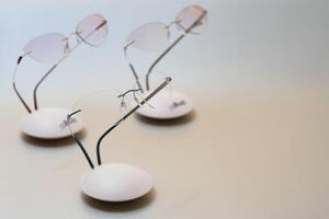 Stylish eyeglasses. Modern eyeglass frames on a colored background photo