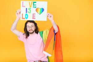 Portrait of a gay man on a colored background. Gender equality. The concept of the LGBT community. Equality. photo