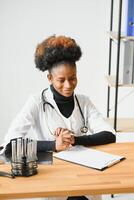 Portrait of a friendly black female doctor. photo